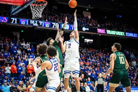 Tyson Degenhart reaching up for the ball.