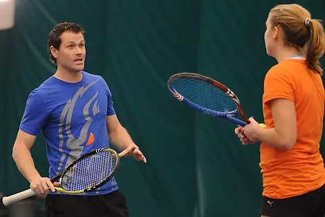 Head coach Beck Roghar instructs Junior Sonia Klamczynska on gaining the offensive position while maintaing strategy. Boise State women's tennis next home game is February 25th vs Arizona. Photo: Robby Milo