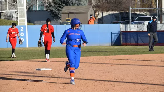 Mykenzie Hanna runs between second and third base after hitting a grand slam against Utah.