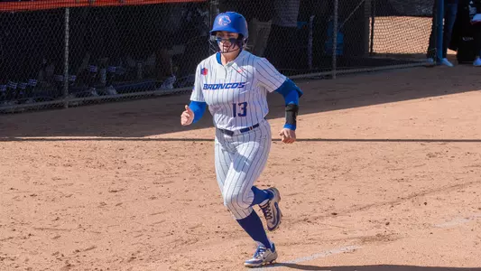 Mykenzie Hanna running toward home plate.