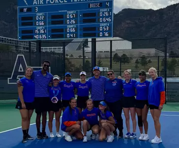 The Boise State women's tennis team posing for a photo following a 4-3 victory over Air Force