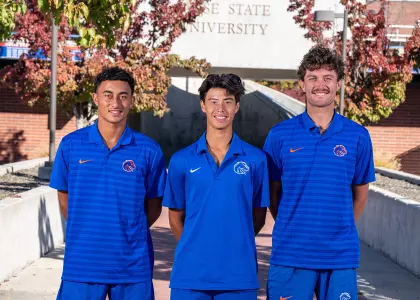 2025 men's tennis seniors, John Chin, Jett Middleton and James Van Herzeele, pose for group photo.