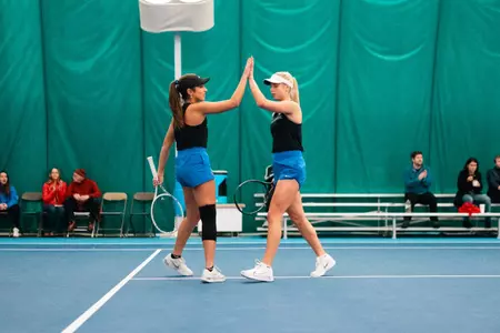Maya Dutta and Zdena Safarova high-fiving