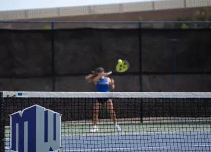 Mountain West Logo with a tennis player hitting a ball in the background