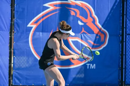 Ari hitting a backhand