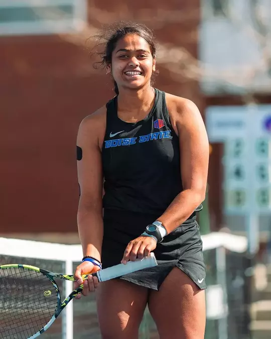 Bhakti Shah celebrates with a big smile after at point during the Utah State match in 2025.