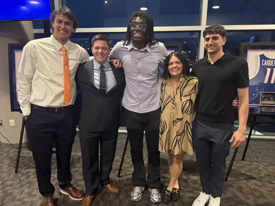 Tyson Degenhart poses with senior class teammates and support staff