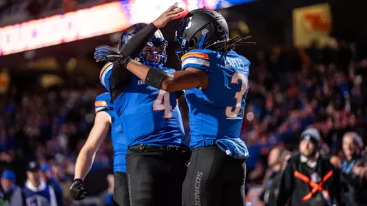 Maddux Madsen and Latrell Caples celebrate a touchdown against San Diego State