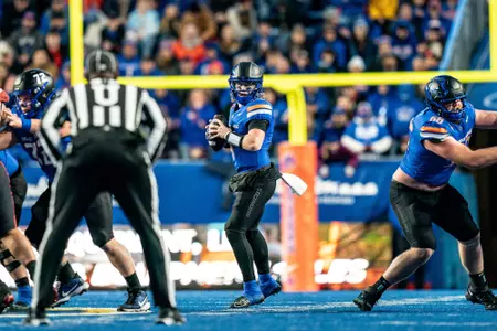 Maddux Madsen dropping back to pass against San Diego State