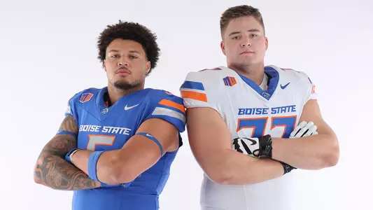 Jayden Virgin-Morgan in blue jersey and Kage Casey in white jersey, both with arms crossed at Mountain West Media Day