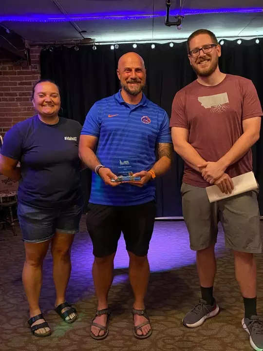 Tyler Smith receiving the Service Award from the Idaho Athletic Trainers Association