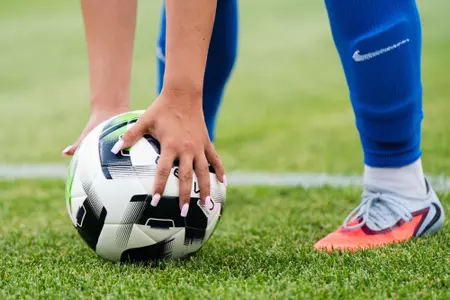 Olivia Collins lays down soccer ball