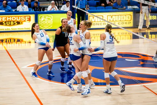Team, dressed in white, celebrates a point during the UC San Diego match on Sept. 4.