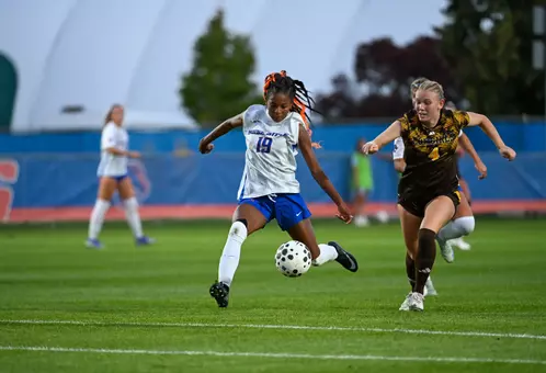Asia Lawyer, in a white jersey, looks to take a shot in the offensive half.