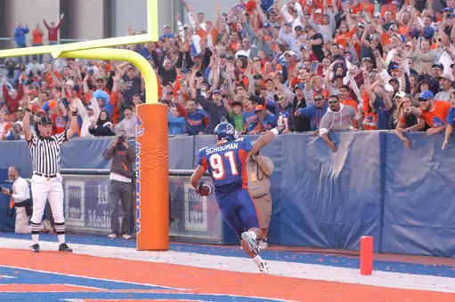 Derek Schouman pointing to the crowd after catching a touchdown