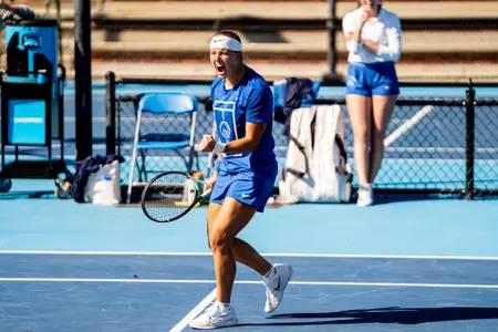 Masa Viriant fist bumping after winning a point