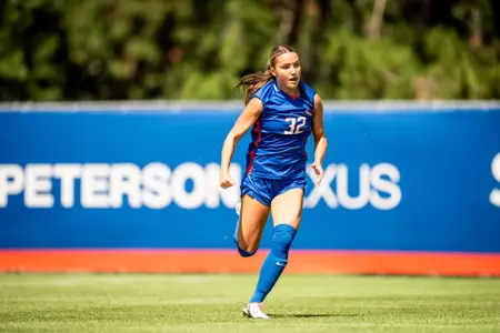 Tambree Bell, wearing a blue jersey, looks for a pass against CSUB