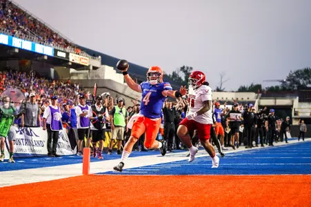 Maddux Madsen rushes for a touchdown in the victory over Eastern Washington.