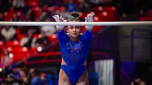 Carly Buell beginning her bars routine