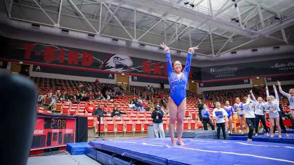 Sydney Kho celebrating after vault routine at Southern Utah