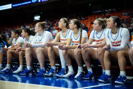 WBB Bench watching the game.