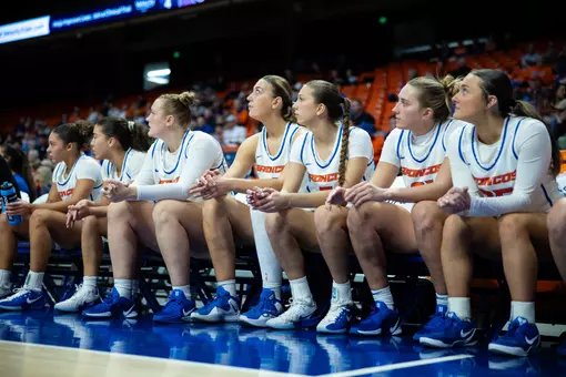 WBB Bench watching the game.