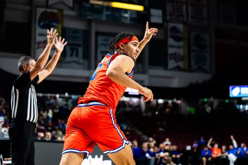 Julian Bowie celebrates after making a 3-pointer against Washington on Oct. 17 at Idaho Central Arena.