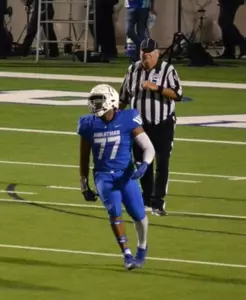 Tyler Ethridge playing football at Midlothian High School