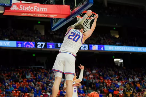 Drew Fielder dunls the basketball against San Jose State
