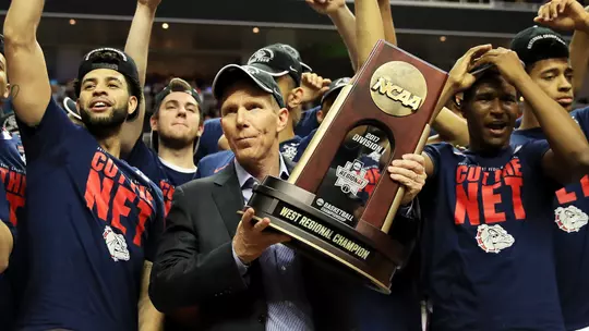 SAN JOSE, CA - MARCH 25: Head coach Mark Few of the Gonzaga Bulldogs and his team celebrate with the trophy after their 83 to 59 win over the Xavier Musketeers during the 2017 NCAA Men's Basketball Tournament West Regional at SAP Center on March 25, 2017 in San Jose, California. (Photo by Ezra Shaw/Getty Images)