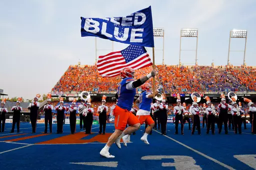 Boise State football players with Bleed Blue/USA Flags