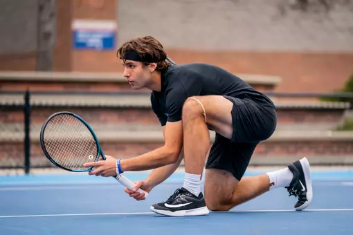 Stewart Aronson preparing for a serve.