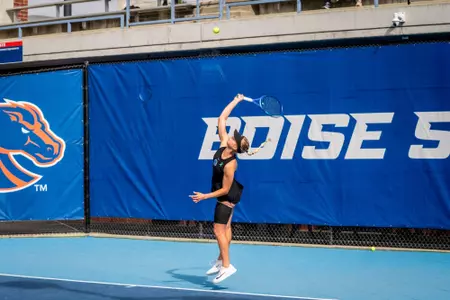 Zdena Safarova hitting a serve