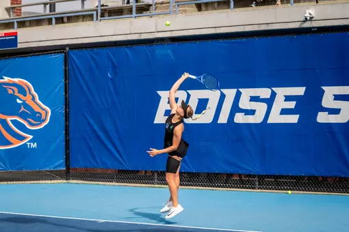 Zdena Safarova hitting a serve