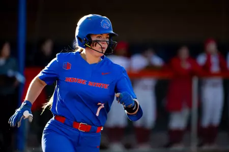 Kate Penberthy runs to first base against New Mexico.