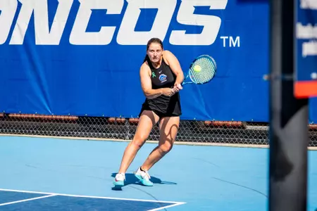 Carla Grignac hitting a backhand shot