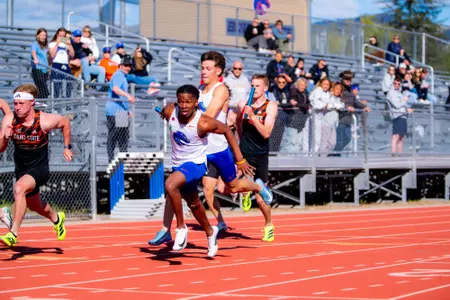 Josh Green handing the baton to Harvey Scott