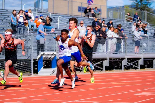 Josh Green handing the baton to Harvey Scott