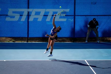 Lorelyz Marruffo hitting a serve