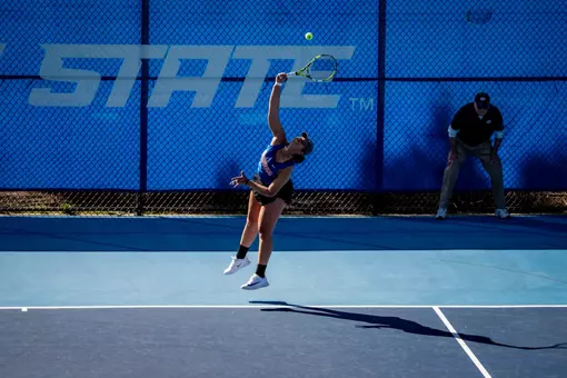 Lorelyz Marruffo hitting a serve