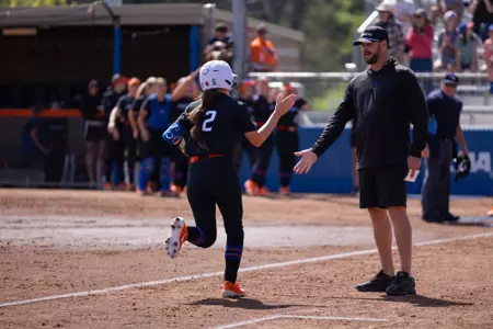 Marissa Gonzalez rounds third bases after hitting a home run.