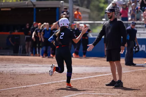 Marissa Gonzalez rounds third bases after hitting a home run.