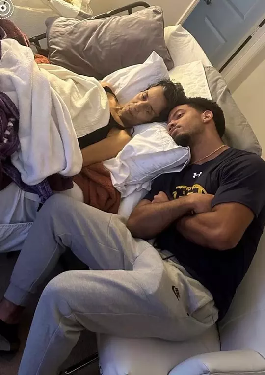 Jaden Mickey nestles close to his mom