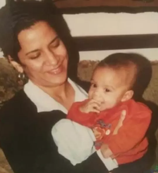 Nilka Mickey holds Jaden Mickey in her arms