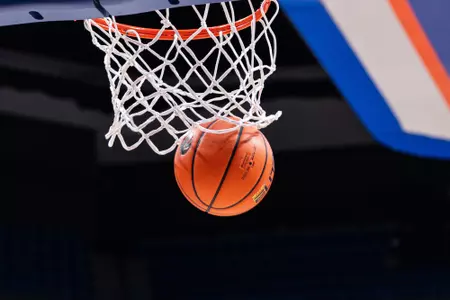 Basketball going through the hoop.