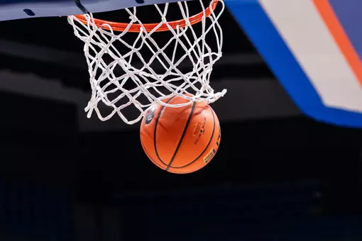 Basketball going through the hoop.