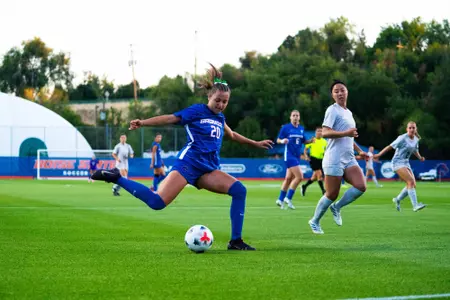 Jillian Anderson kicking the ball.