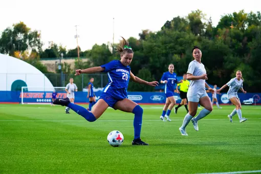 Jillian Anderson kicking the ball.