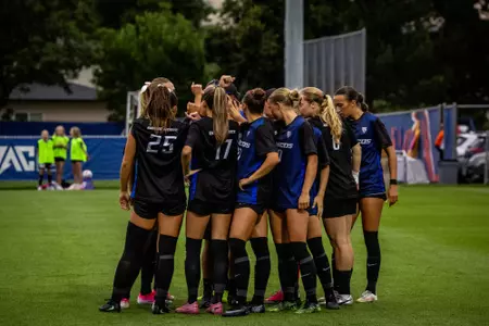 Boise State soccer team huddle.