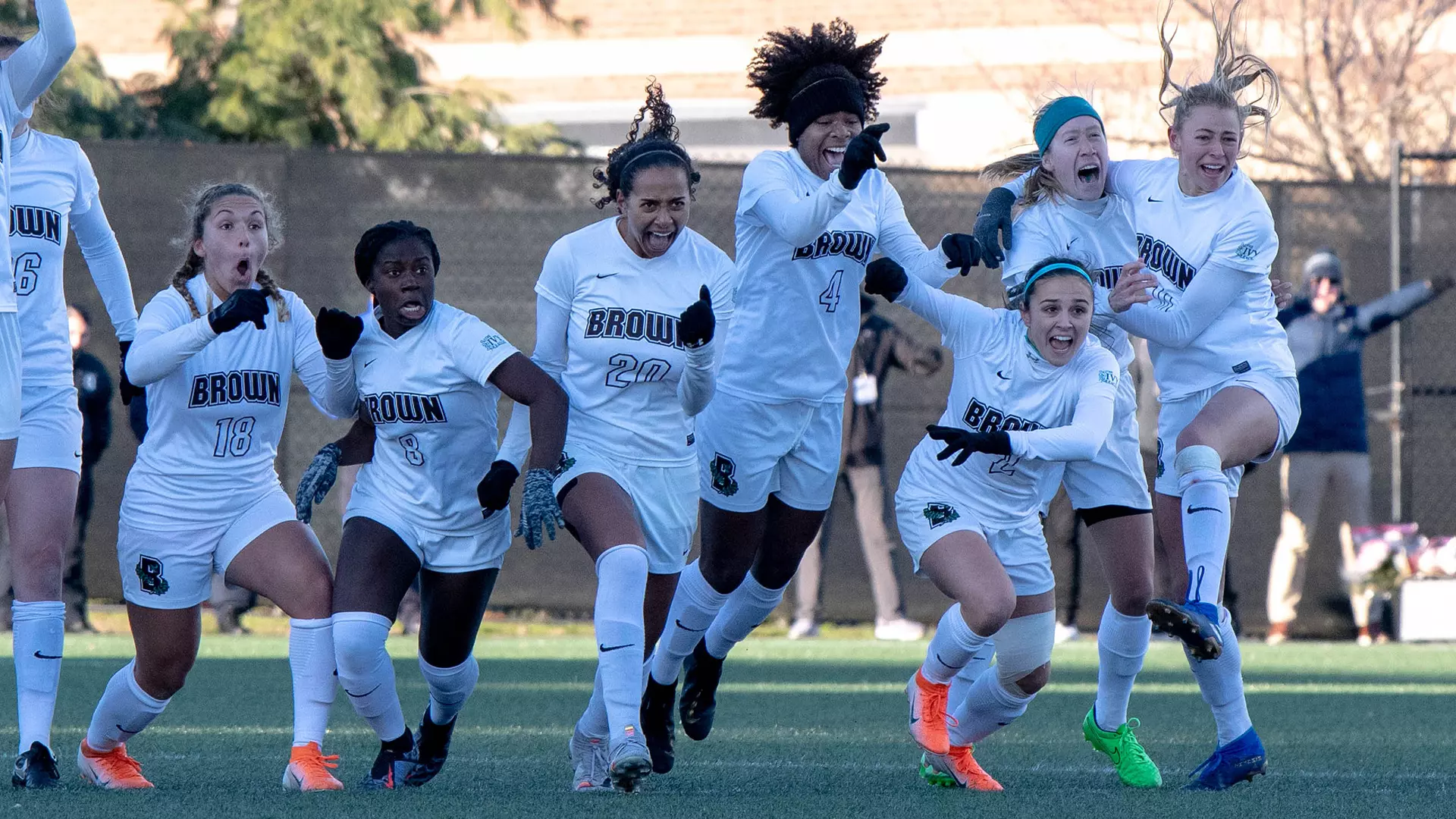 Celia Story (third from right) and teammates celebrate the winning penalty kick against Monmouth.